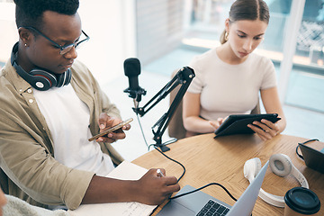 Image showing Laptop, podcast team and people in office for live streaming, content creation and talk show. Collaboration, studio and man and woman with microphone, computer and technology for radio broadcast