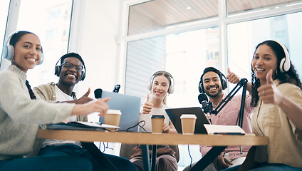 Image showing Men, women and group with laptop, podcast and thumbs up in portrait for success, review or opinion. Team, microphone and headphones for web talk show, broadcast and sign language for emoji at desk