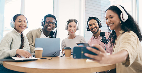 Image showing Podcast, smile and group selfie of friends together bonding, live streaming and people recording broadcast in studio. Happy team of radio hosts take picture at table for social media or collaboration