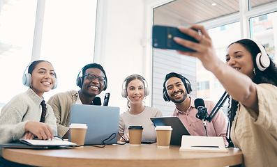 Image showing Podcast, happy and group selfie of friends together, live streaming or people recording broadcast on headphones or mic in studio. Smile, team and radio hosts take photo at table for social media blog