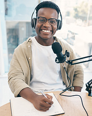 Image showing Portrait, podcast and black man with a notebook, microphone and smile with news broadcasting. Face, African person and radio presenter with tech, share information and writing with content creator