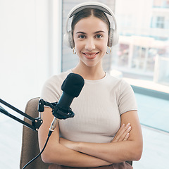 Image showing Radio presenter, portrait and happy woman with arms crossed in a booth for live streaming, broadcast or reporting. Speech, face and proud female talk show host smile in a studio for news announcement