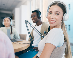 Image showing Radio, broadcast and portrait of woman in office with people recording, audio or streaming conversation. Podcast, hosting and presenter with headphones, microphone and happy group broadcasting news