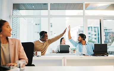 Image showing Happy business people, call center and high five in teamwork, winning or promotion together at office. Businessman touching hands in customer service, telemarketing or success for contact us or sale