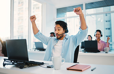 Image showing Call center, man and cheers at laptop for success, CRM bonus and winning promotion in coworking agency. Happy asian salesman celebrate achievement of deal, telemarketing profit and fist at computer