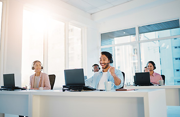 Image showing People, winning and computer in call center success, celebration and yes for telemarketing sales, target or goals in office. Happy consultant or man in wow, fist and excited for telecom bonus or news