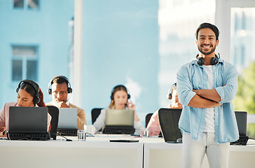 Image showing Happy asian man, portrait and call center professional in confidence, customer service or leadership at office. Male person, consultant or agent manager smile with arms crossed in contact us or help