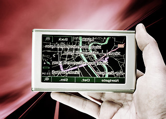 Image showing GPS Vehicle navigation system in a man hand.