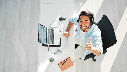 Image showing Call center, customer support and top view of man with thumbs up for consulting, sales and online help. Telemarketing, communication and portrait of happy worker for CRM business, service and contact