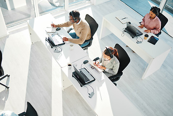 Image showing Call center, group and team at telemarketing help desk with laptop for customer service, IT support or coworking agency from above. Sales people, online consulting and questions for telecom advisory