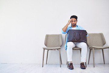 Image showing Bag, stress and man search in waiting room for interview, hiring and recruitment with lost resume in briefcase. Problem, finding and person forget laptop or keys by mistake, frustration and worried