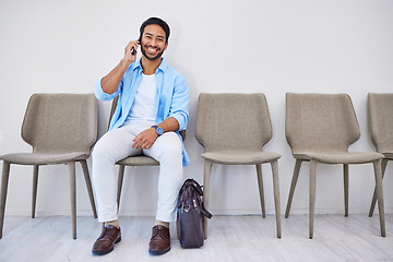 Image showing Recruitment, phone call and man in an office for interview in job search for appointment. Hiring, career and Indian male person on mobile conversation for meeting with human resources in workplace.