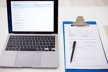 Image showing Health, checklist and laptop on table in office, hospital or survey information and insurance data. Paperwork, questions and computer with form for medical results, report and healthcare review