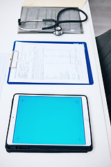 Image showing Tablet mockup, screen and hospital desk, healthcare background and documents for medical services. Digital technology, blue space and paperwork with empty clinic for registration, report or charts