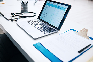 Image showing Health, office and checklist with laptop on table in hospital for survey, information and insurance data. Paperwork, questions and computer with form for medical results, report and healthcare review