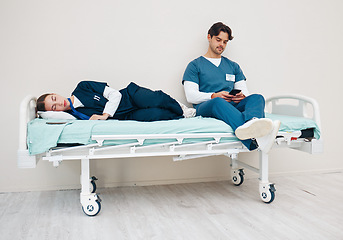 Image showing Tired doctors, sleeping woman and man with phone, texting and relax on break at hospital job. Medic team, partnership or friends with burnout, smartphone and fatigue with healthcare, clinic and rest