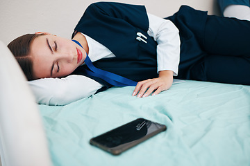Image showing Sleeping, hospital and tired nurse with phone for rest, nap and break for burnout, exhausted and fatigue. Healthcare, insomnia and worker relax for medical service, wellness and stress in clinic
