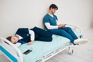 Image showing Sleeping, hospital and nurses with phone for break, nap and rest for burnout, exhausted and fatigue. Healthcare, team and health workers relax for medical service, wellness and stress in clinic