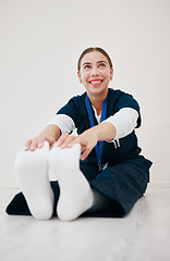 Image showing Stretching, legs and nurse with feet on floor in exercise, pilates or start of shift in clinic and healthcare. Work, preparation and warm up body for wellness, meditation and fitness in hospital