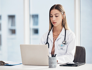 Image showing Doctor, woman and laptop for hospital research, medical study and planning for telehealth or clinic report. Healthcare worker or student working on computer for website information, review or service