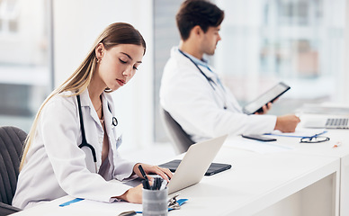 Image showing Doctors, healthcare and coworkers working at desk for planning, research and medical schedule at workspace in hospital. Medicine, man and woman with collaboration, teamwork or brainstorming results