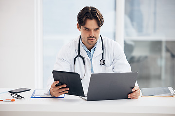 Image showing Laptop, man or doctor on tablet for research, medical update or telehealth web service in clinic. Reading news info, PC or surgeon in professional healthcare with digital tech for email in hospital