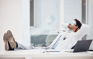 Image showing Man, doctor and sleeping with face mask in relax for done, completion or finished at hospital office. Tired male person, medical surgeon chilling on break, rest or asleep on work desk at clinic