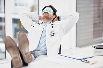 Image showing Man, doctor and sleeping with face mask on break or relax for done, completion or finished at hospital office. Tired male person or medical surgeon chilling for rest or asleep on work desk at clinic