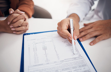 Image showing Doctor, hands and writing on documents with patient for life insurance, policy or legal agreement at hospital. Closeup of medical employee showing paperwork, agreement or checklist on desk at clinic