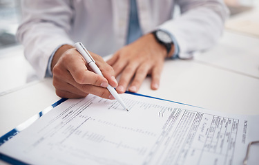 Image showing Closeup, doctor and hands with document for writing on insurance form, information or chart of patient for treatment. Healthcare professional, nurse or specialist with clipboard for medical history