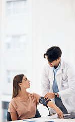 Image showing Doctor, woman and blood pressure machine for healthcare, health assessment or check up at hospital. Hypertension, professional or person with monitor, digital equipment or exam for wellness at clinic