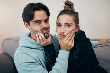 Image showing Relax, cute and portrait of couple on sofa for bonding, healthy relationship and love in living room. Dating, happy and man and woman holding face for silly, goofy and playful fun at home together