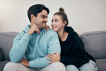 Image showing Smile, bond and couple relax on a sofa with care, hug and support at home together. Love, face and happy young people in a living room connect, chilling and enjoy weekend, relationship or day off