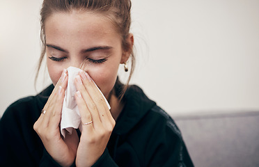 Image showing Woman, sick and couch with tissue, sickness and virus for infection, sinus and cold symptoms. Sneeze, blowing nose and allergy in living room sofa, hayfever and healthcare for disease, fever or alone