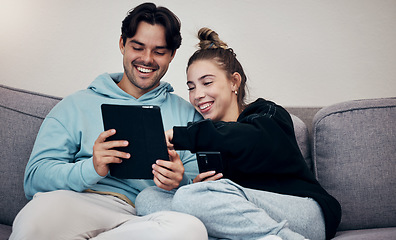 Image showing Couple, phone and tablet with laugh on sofa for social media, internet scroll and funny meme with relax. People, man or woman on couch with smartphone and touchscreen for technology and web streaming