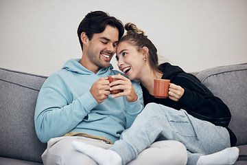 Image showing Couple, tea and relax with smile, love and trust on sofa in living room of home or apartment with bonding. Coffee, man and woman together with happiness for peace, romance and commitment on couch