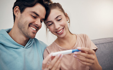 Image showing Pregnancy, test and happy couple in home living room, reading good news and check positive results. Stick, man and pregnant woman smile on sofa excited for family, future maternity and ivf fertility