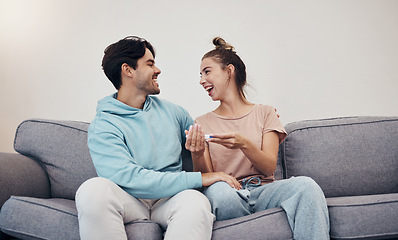 Image showing Pregnancy test, happy and couple in home living room, reading good news or check results. Kit, excited man and pregnant woman or mother smile on sofa for success, future maternity or ivf fertility