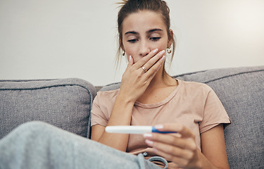 Image showing Pregnancy test, surprise and woman on sofa in home, reading bad news and check negative results. Pregnant, stick and sad mother in living room shocked for maternity, stress and anxiety for fertility