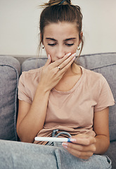 Image showing Pregnancy test, shock and sad woman on sofa in home, reading bad news and check negative exam results. Stick, surprise and pregnant mother depressed in living room for maternity, stress and anxiety