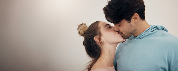 Image showing Happy, couple and kiss with love in banner, white background or studio mockup of partnership, loyalty or marriage. Romantic, people or bonding with partner in affection with support and care together