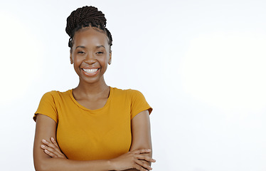 Image showing Portrait, happy woman and arms crossed in studio with mockup, confidence and good mood in Nigeria. Young african model smile with pride, face and personality isolated on white background space