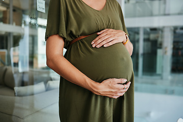 Image showing Pregnancy care, stomach and hands of woman feeling, massage and touch baby development, body or belly. Maternity, office closeup and pregnant person love, support and hope for future motherhood