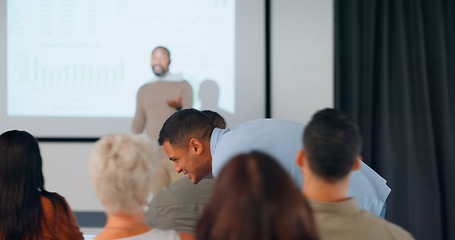 Image showing Conference, presentation and man whisper in audience of training workshop, entrepreneur training and seminar. Business, people and speaker or coach share knowledge, information or strategy in meeting