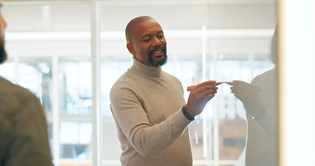 Image showing Business people, brainstorming or black man writing on board for coaching, learning or mentorship advice. Startup training, manager or presentation with ideas for strategy, mission or planning