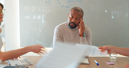 Image showing Tired, businessman and headache in meeting with paperwork, people and fatigue in office or conference room. Team, manager and employee with burnout, migraine or anxiety for documents and report