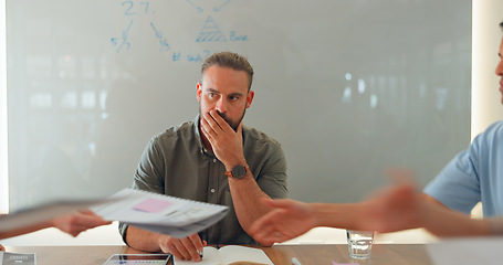 Image showing Man, thinking and meeting at work or stress for team documents, tired or management. Male person, board room and table or employee strategy for collaboration papers, office fatigue or problem solving