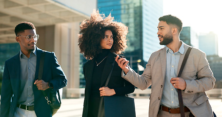 Image showing Business people, phone and walking in city for team, communication and networking or talking of travel opportunity. Professional employees, men and women outdoor, mobile chat or contact information