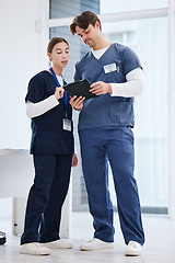 Image showing Healthcare, man and woman with tablet in office at hospital with research, advice and teamwork. Medical professional, nurse and doctor with digital app for telehealth, insurance website and schedule.