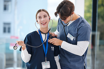 Image showing Couple, happy and doctors with stethoscope for love, relationship and work romance in clinic. Healthcare team, hospital and playful man and woman in medical service, support and medicare career